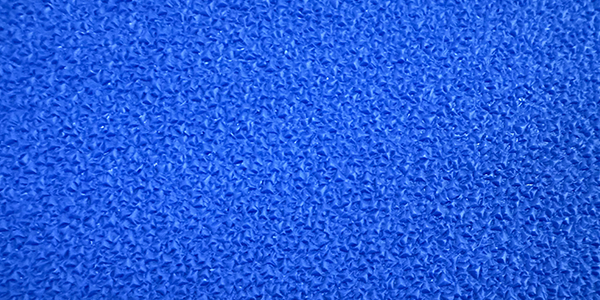 Textured blue surface with intricate pattern